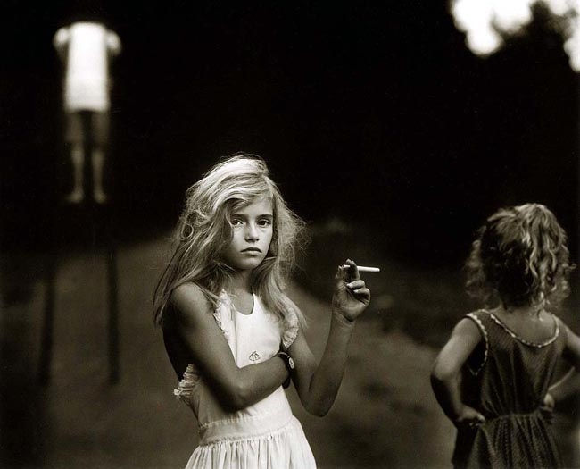 Young girl smoking a cigarette 